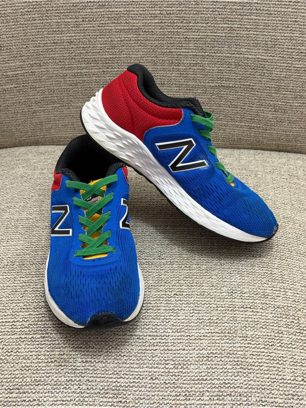 New Balance Kids Blue Sneakers with Red Accents and Green Laces